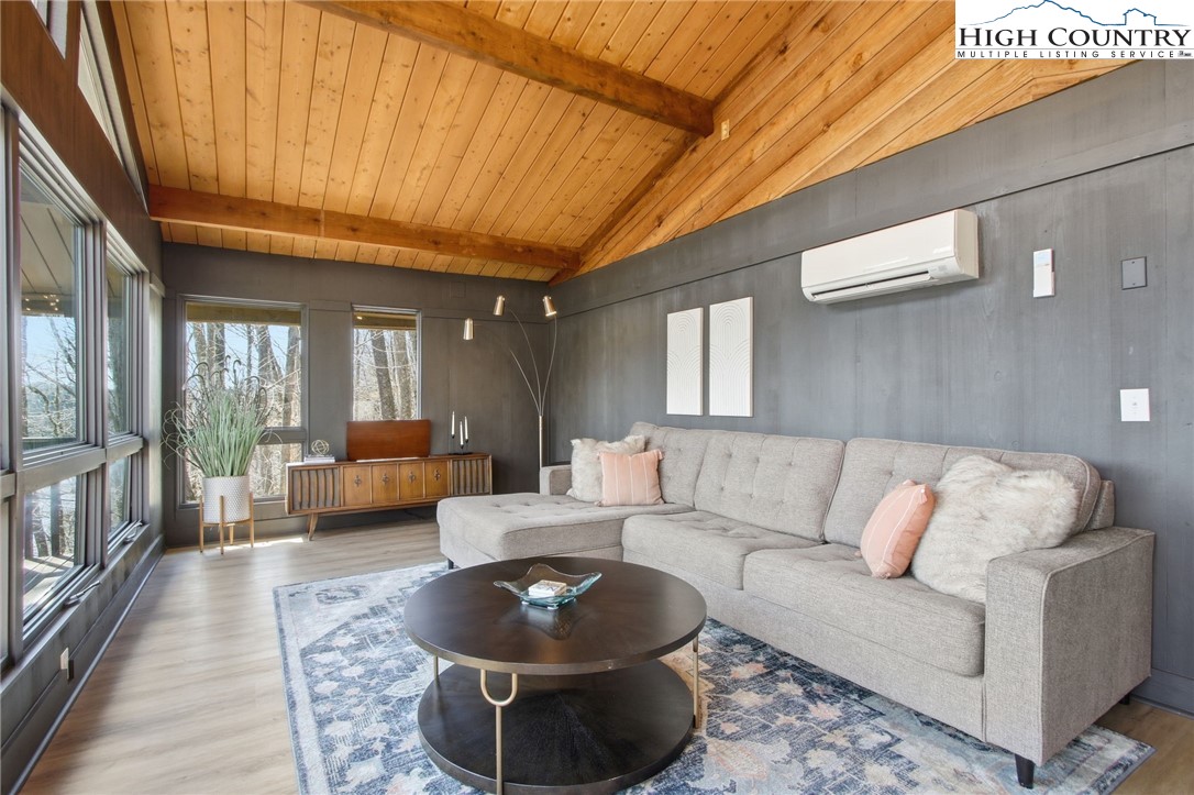 154 Lady Slipper Loop Newland, NC 28657 - Photo 10 of 50 a living room with furniture and a rug