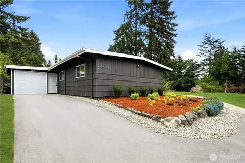 a front view of a house with garage
