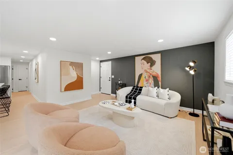 a living room with furniture ceiling fan