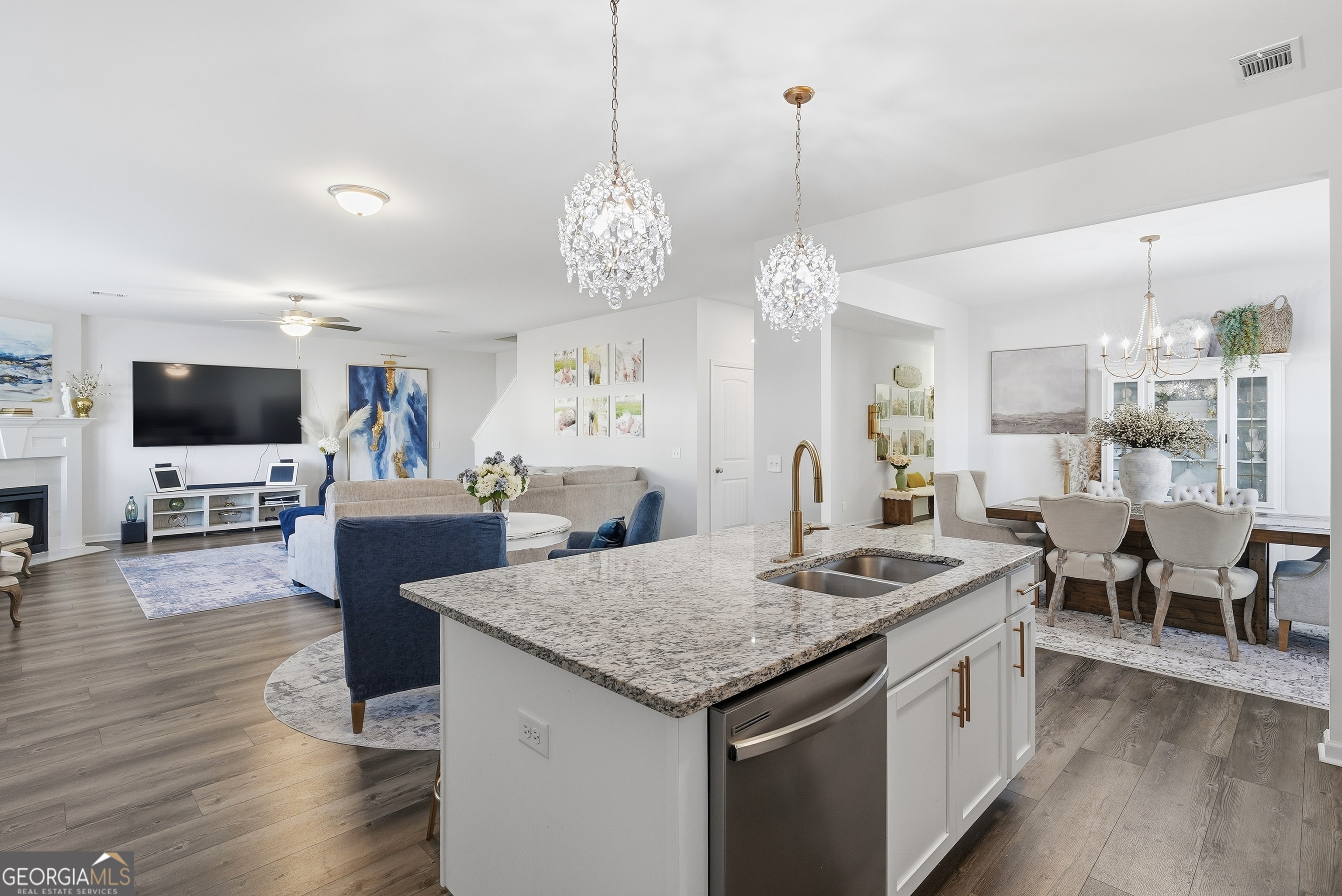 1160 Turpentine Trail Fort Stewart, GA 31313 - Photo 14 of 39 a view of a dining room and livingroom with furniture wooden floor a chandelier