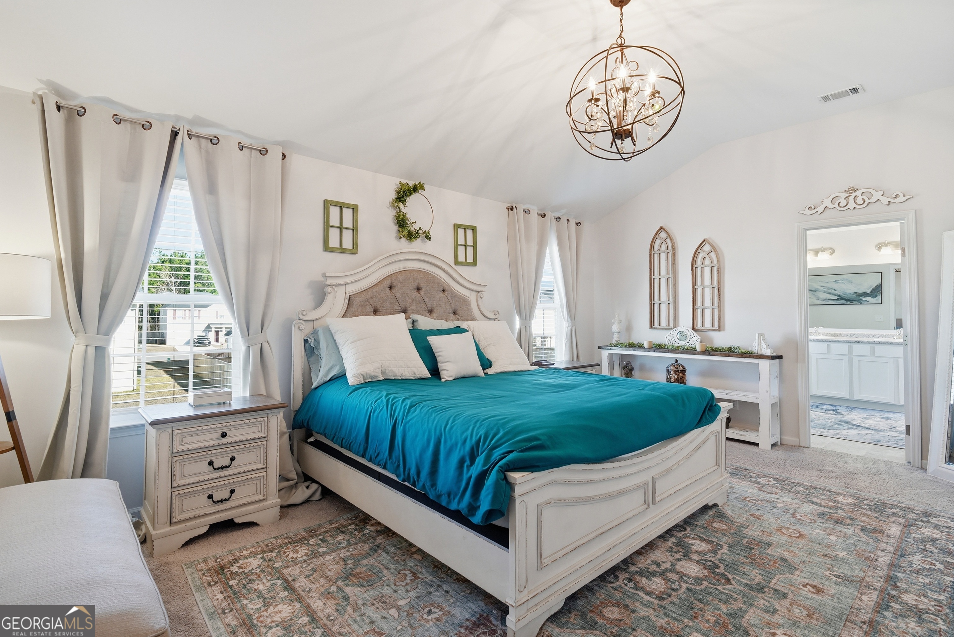 1160 Turpentine Trail Fort Stewart, GA 31313 - Photo 26 of 39 a bedroom with a bed a chandelier and dresser