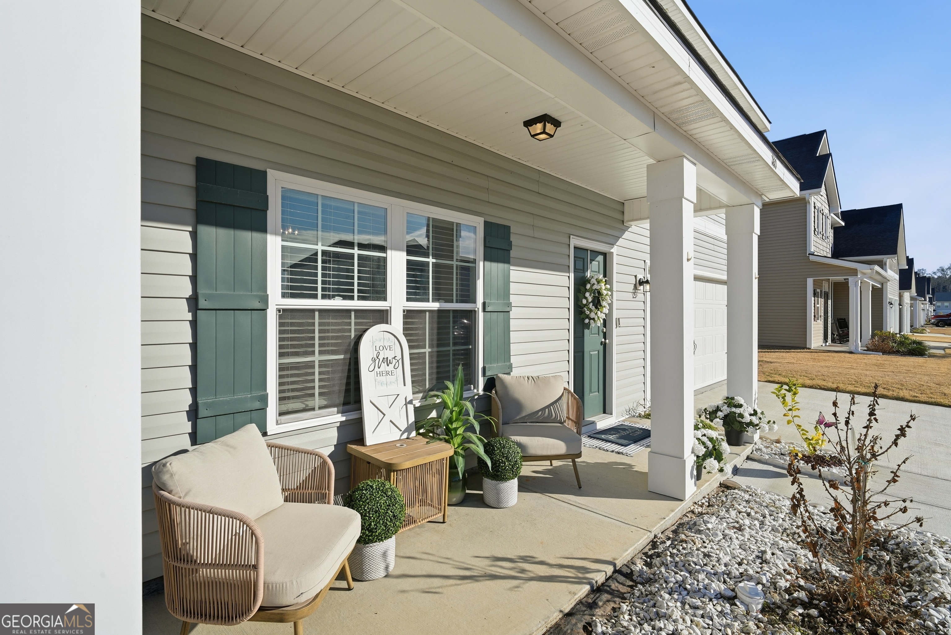 1160 Turpentine Trail Fort Stewart, GA 31313 - Photo 4 of 39 a balcony with furniture and a potted plant