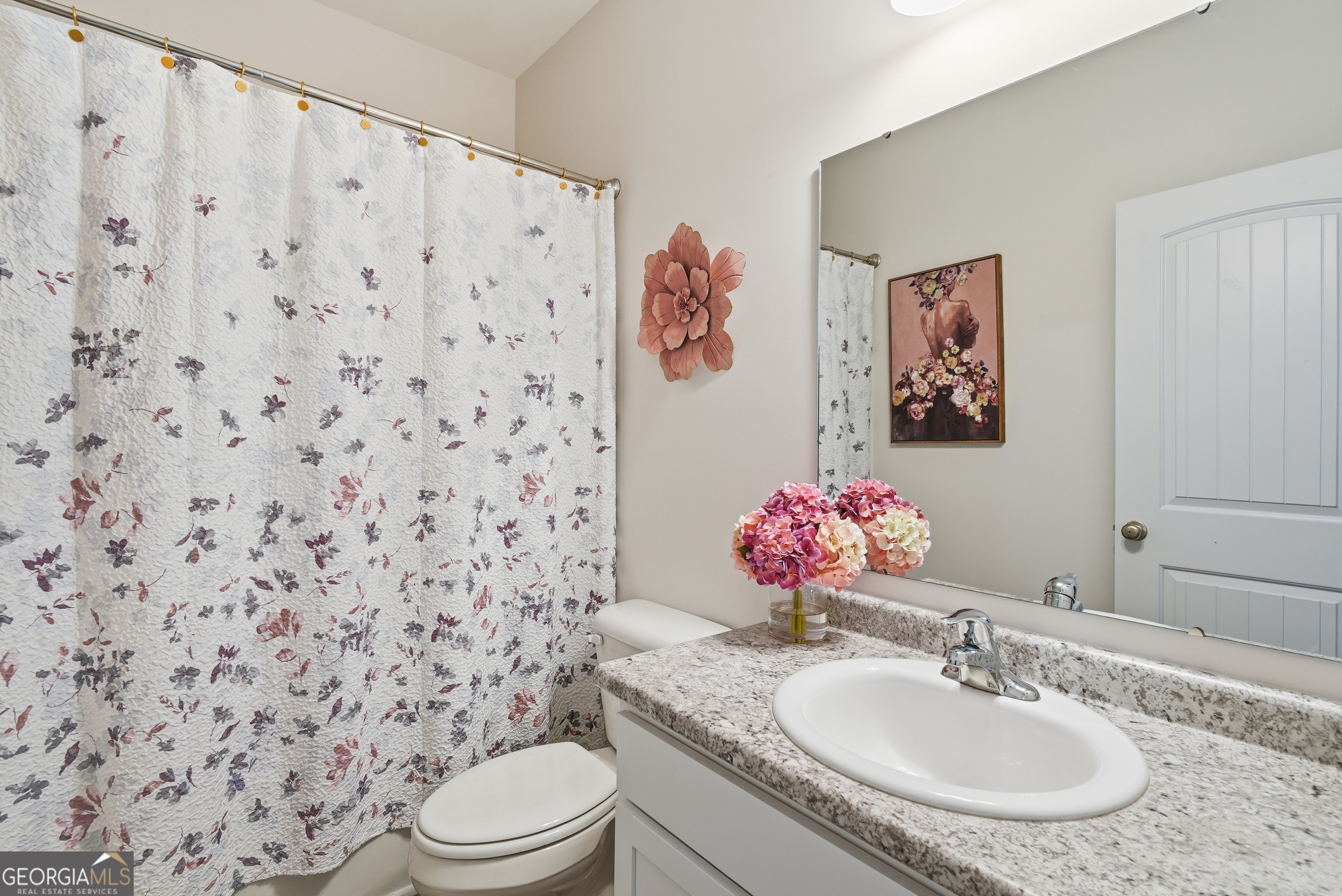 1160 Turpentine Trail Fort Stewart, GA 31313 - Photo 7 of 39 a bathroom with a granite countertop sink mirror vanity and toilet