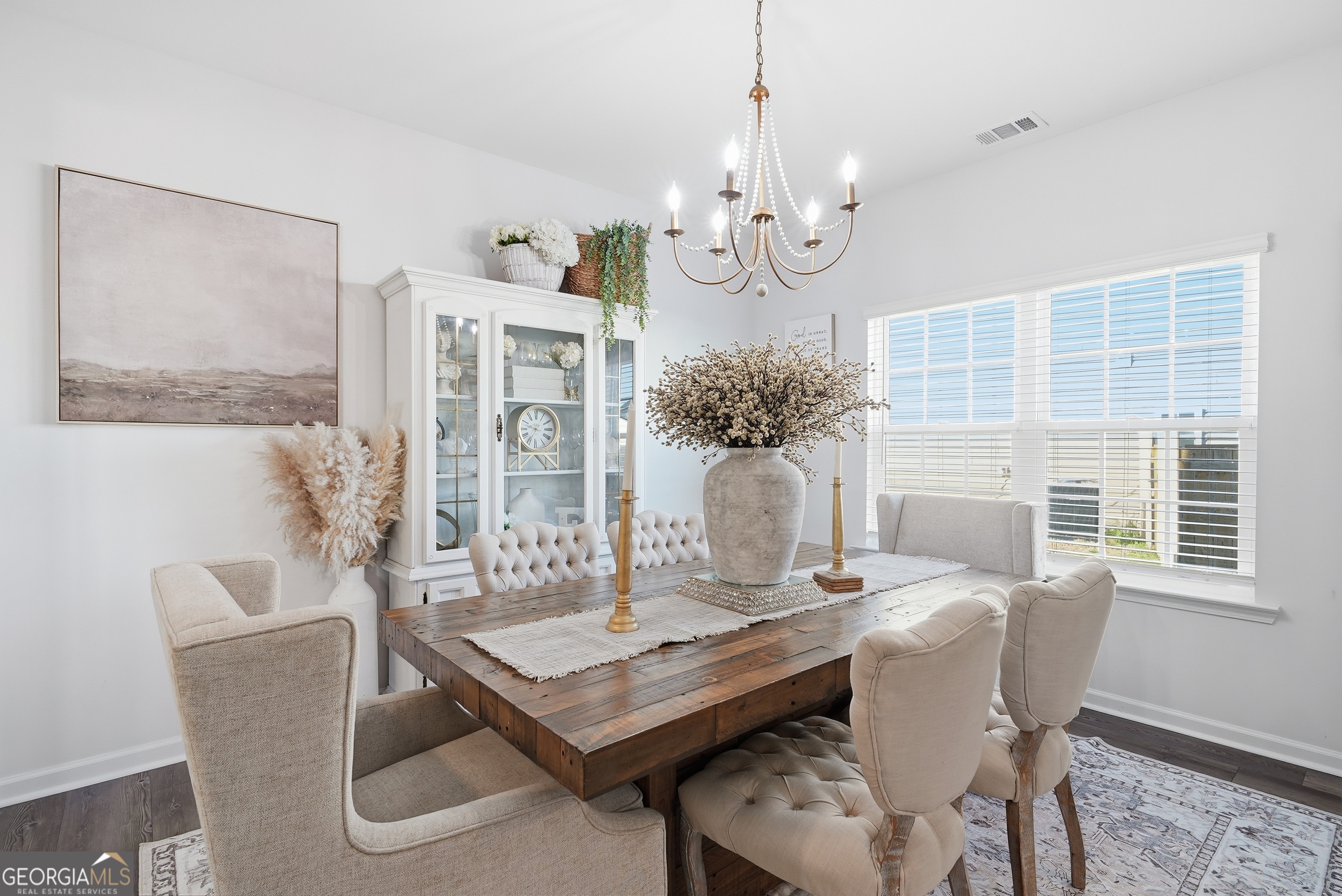 1160 Turpentine Trail Fort Stewart, GA 31313 - Photo 8 of 39 a view of a dining room with furniture window and wooden floor