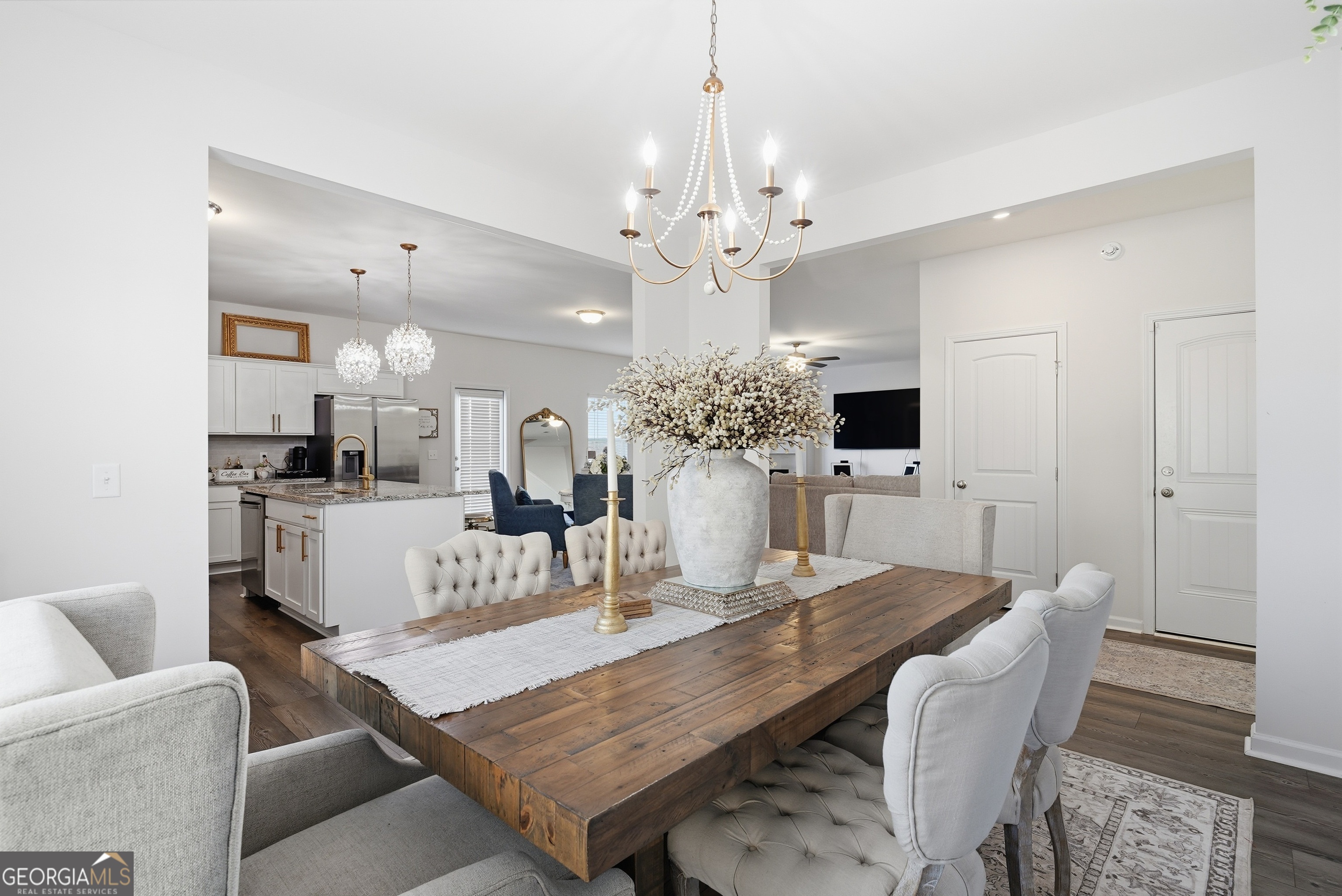 1160 Turpentine Trail Fort Stewart, GA 31313 - Photo 9 of 39 a view of a dining room with furniture and wooden floor