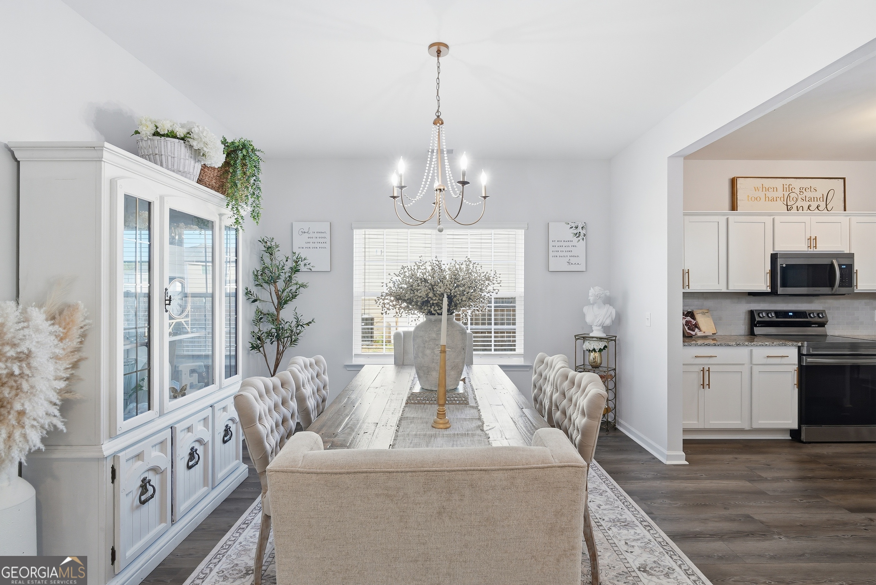 1160 Turpentine Trail Fort Stewart, GA 31313 - Photo 10 of 39 a living room with furniture and a chandelier