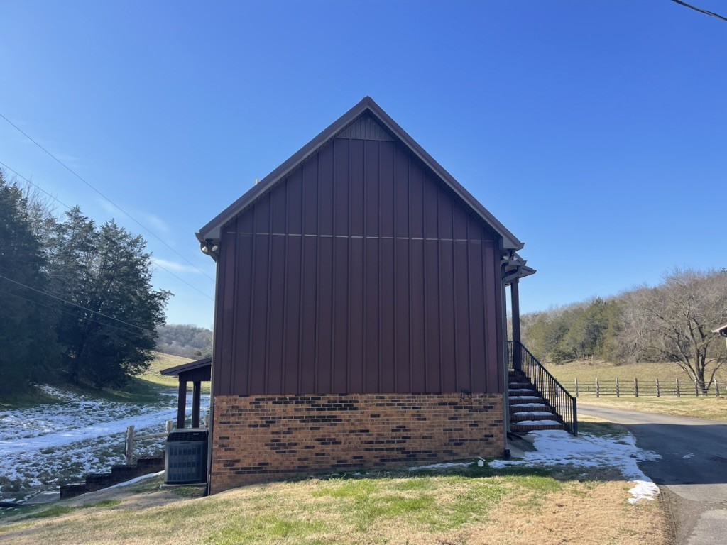 501 Gray Road Lynchburg, TN 37352 - Photo 11 of 44 a view of a small house with wooden fence