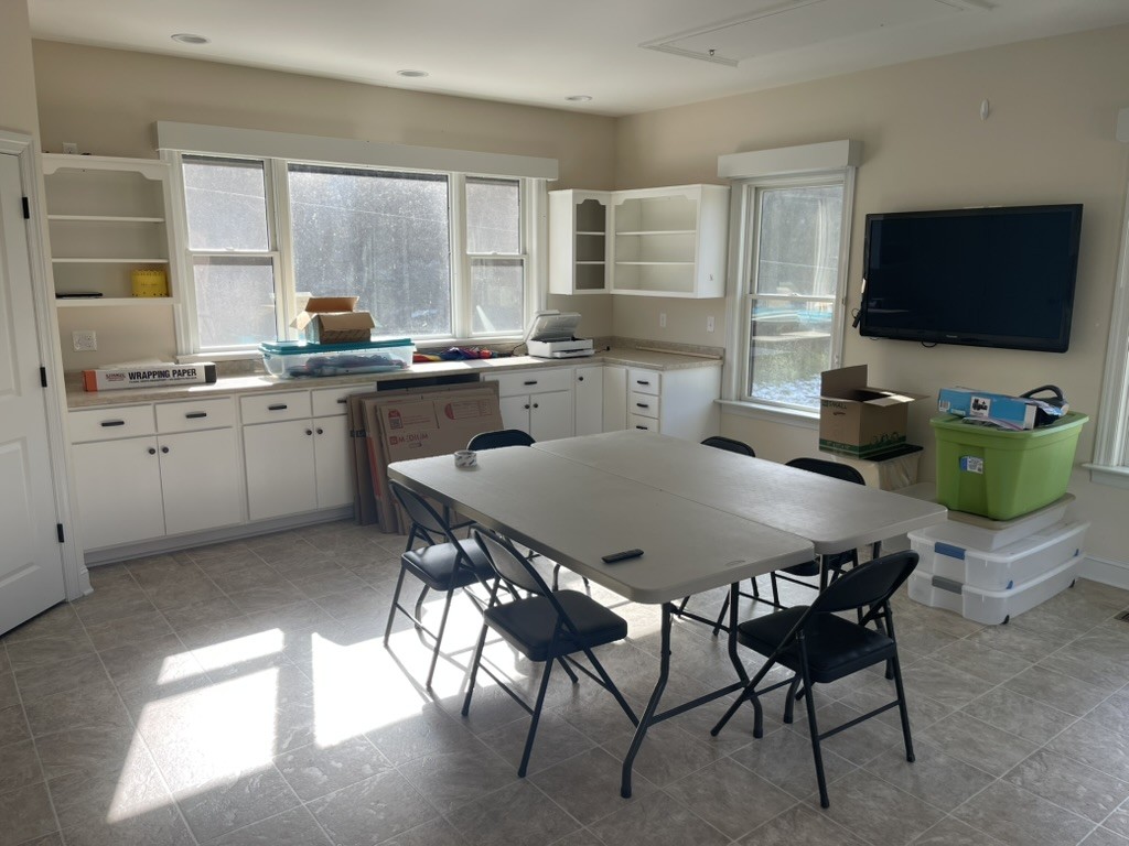 501 Gray Road Lynchburg, TN 37352 - Photo 13 of 44 a kitchen with stainless steel appliances granite countertop a sink a stove a table and chairs