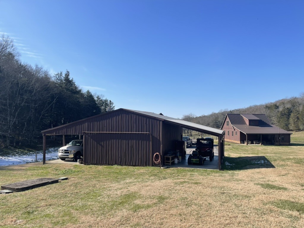 501 Gray Road Lynchburg, TN 37352 - Photo 21 of 44 a view of a house with backyard and sitting area