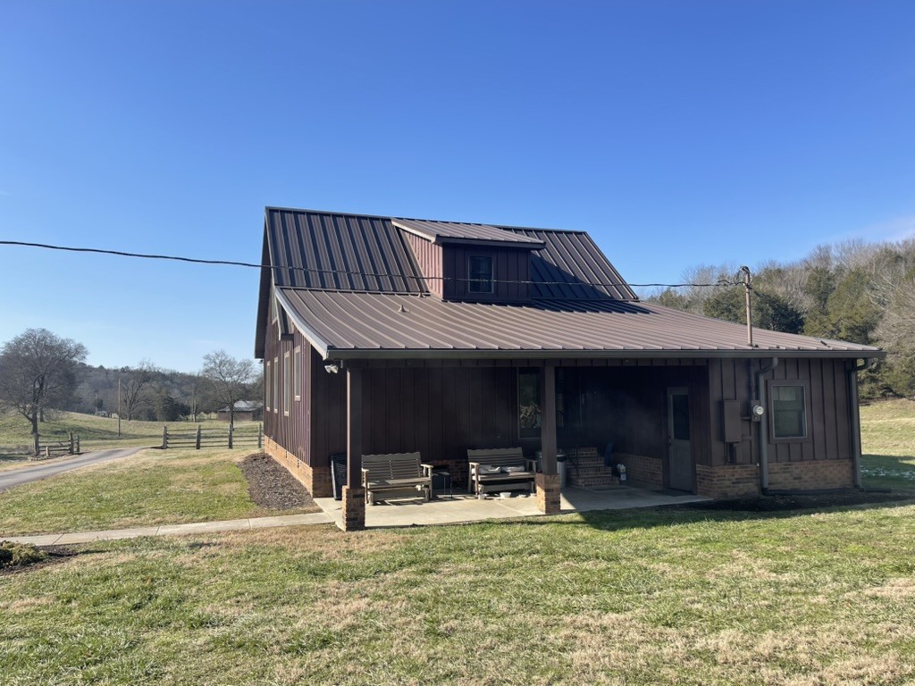 501 Gray Road Lynchburg, TN 37352 - Photo 3 of 44 a view of a house with backyard porch and wooden fence