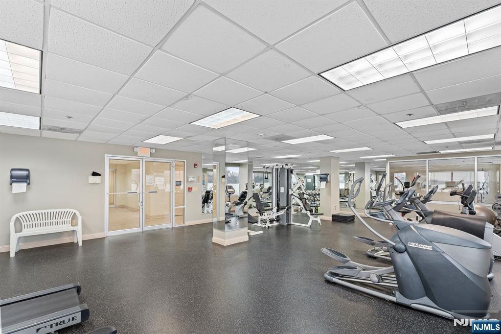 344 The Promenade, Unit 344 Edgewater, NJ 07020 - Photo 34 of 44 a view of a room with gym equipment