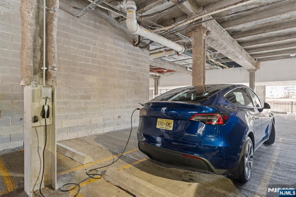 344 The Promenade, Unit 344 Edgewater, NJ 07020 - Photo 39 of 44 a car parked in a garage