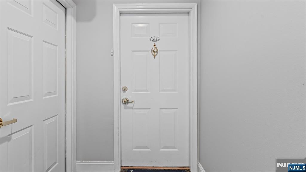 344 The Promenade, Unit 344 Edgewater, NJ 07020 - Photo 5 of 44 a bathroom with a shower