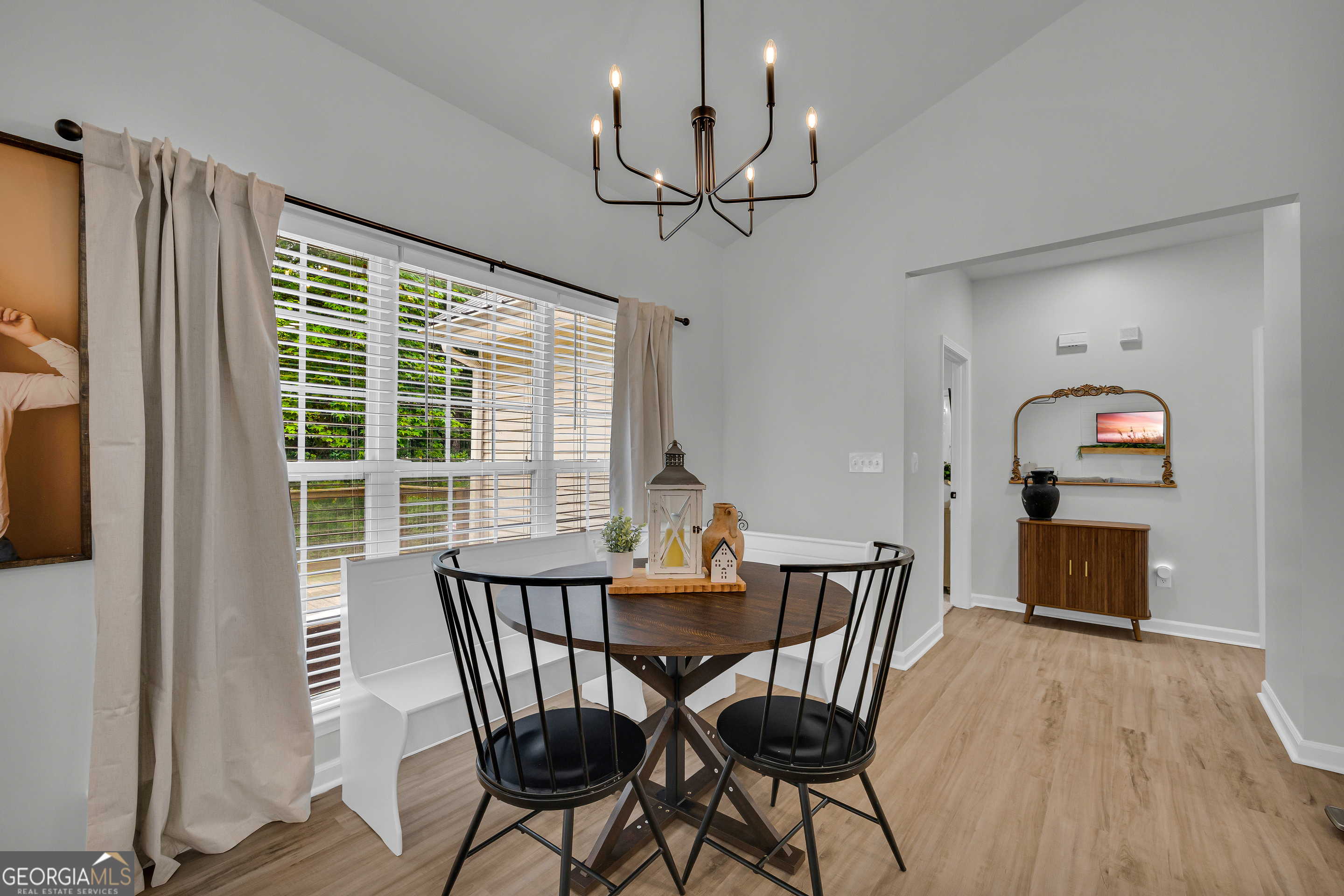 163 Tuxedo Drive Commerce, GA 30530 - Photo 29 of 62 a view of a dining room with furniture window and wooden floor