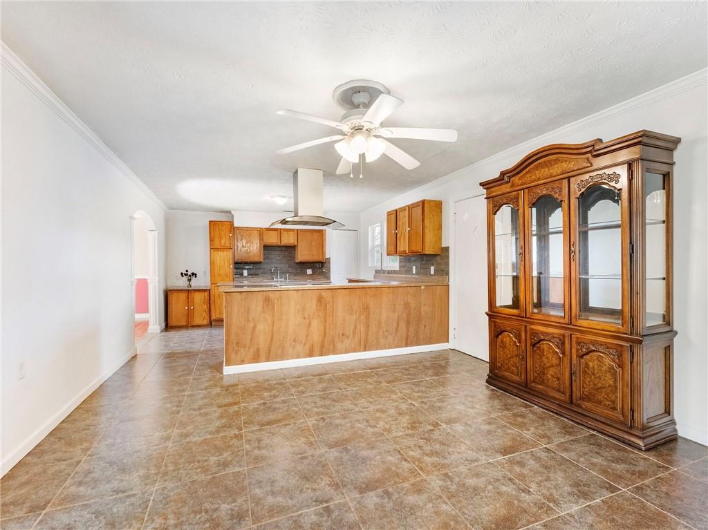 1686 Shoal Creek Road Monroe, GA 30656 - Photo 11 of 50 a view of kitchen with furniture and a ceiling fan