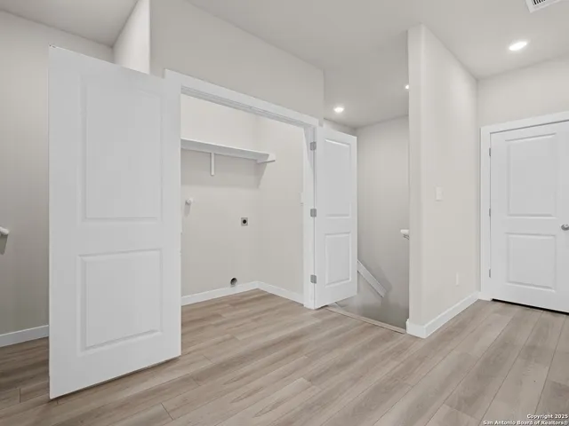 a kitchen with stainless steel appliances granite countertop a refrigerator a stove a sink and a microwave