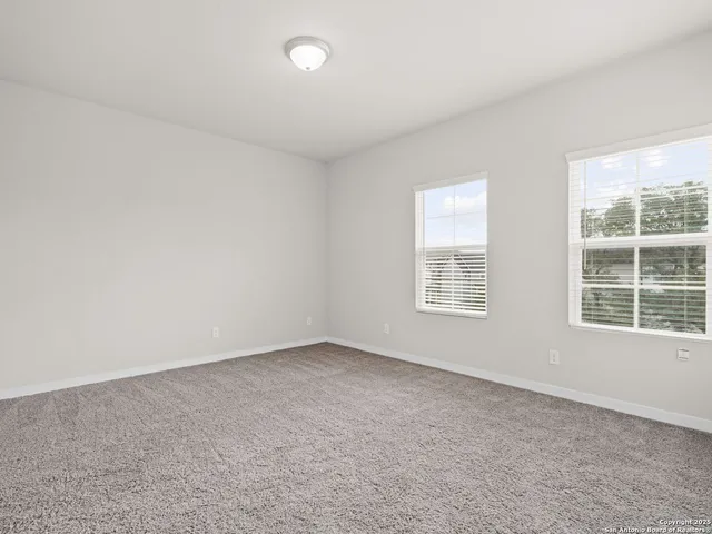 a bathroom with a granite countertop sink a toilet and bathtub