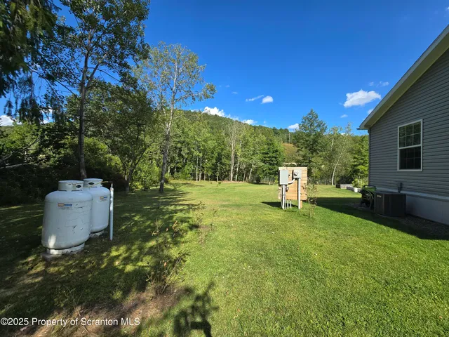 a backyard of a house with lots of green space