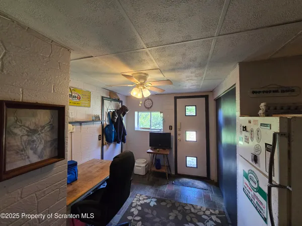 a room with lots of furniture and clutter