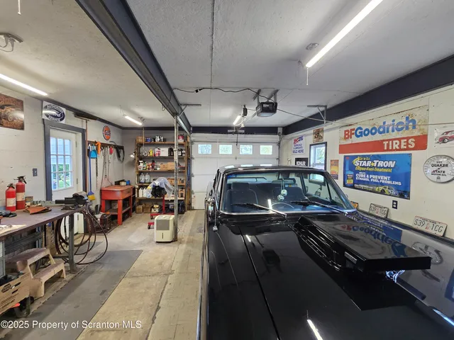 a view of a livingroom with furniture and workspace