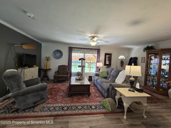a living room with furniture lamp and rug