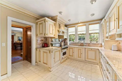 a kitchen with a stove and a refrigerator