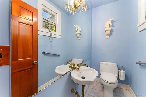 a bedroom with a bed and a television