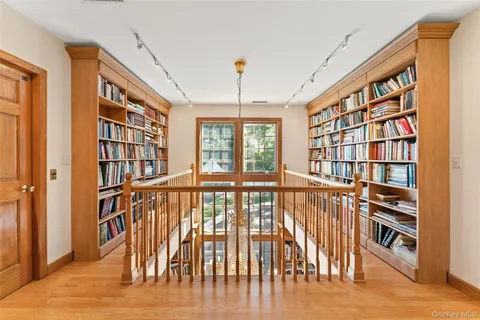 a bed room with a bed and a chair