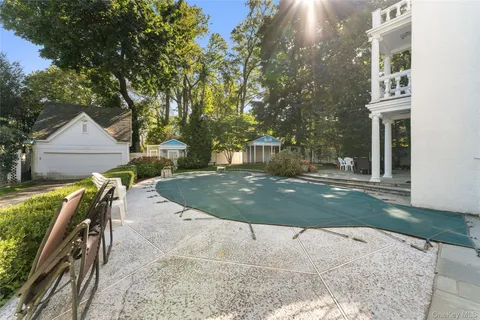 a view of a chairs and table in the patio