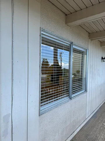 a view of a room that has a large window