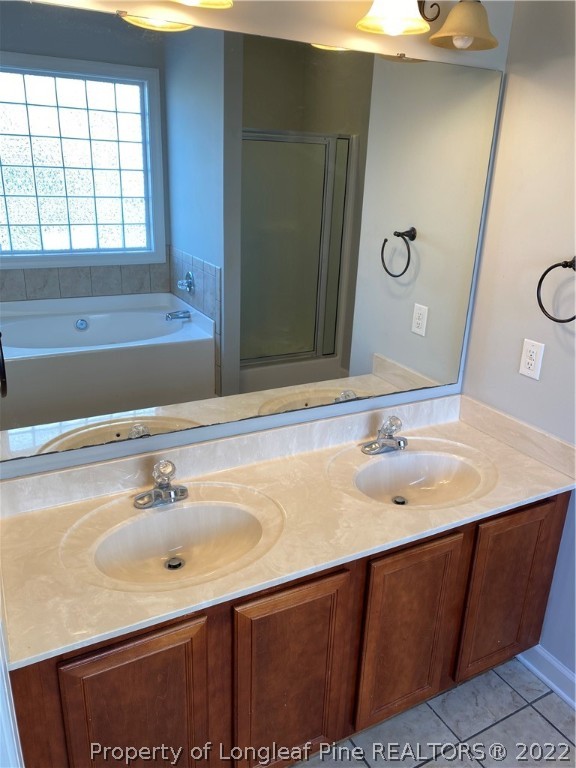 3532 Talus Road Fayetteville, NC 28306 - Photo 22 of 34 a bathroom with a sink and a mirror