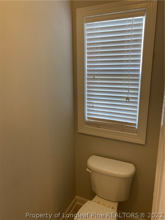 3532 Talus Road Fayetteville, NC 28306 - Photo 26 of 34 a bathroom with a toilet and a window