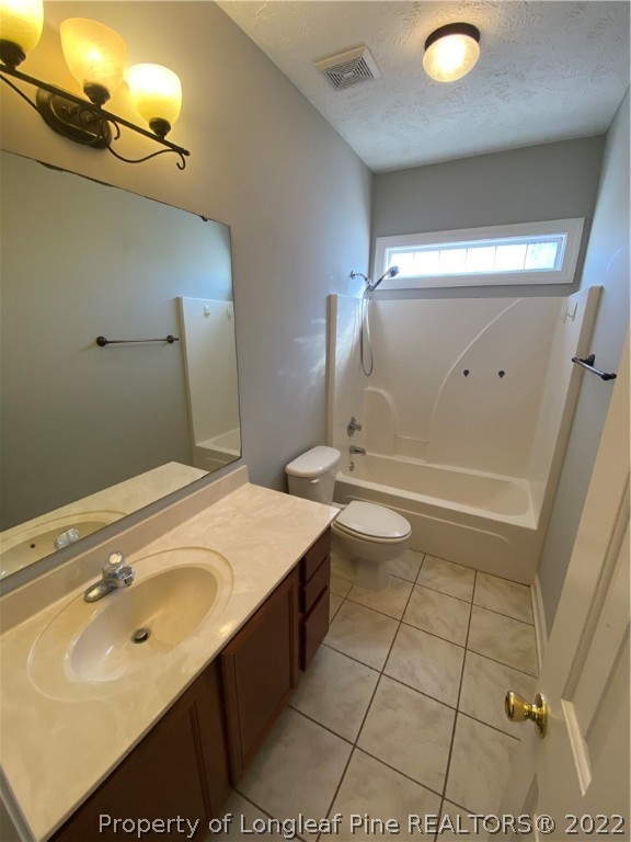 3532 Talus Road Fayetteville, NC 28306 - Photo 30 of 34 a bathroom with a sink toilet and mirror