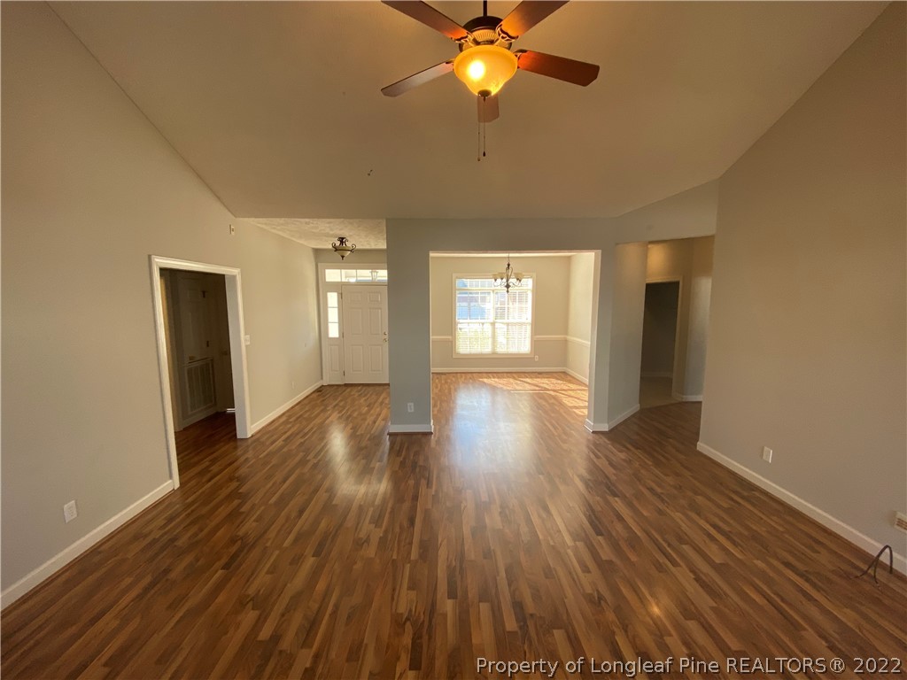 3532 Talus Road Fayetteville, NC 28306 - Photo 9 of 34 a view of an empty room with wooden floor and a window
