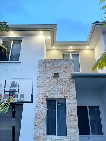 a kitchen with a sink and a refrigerator