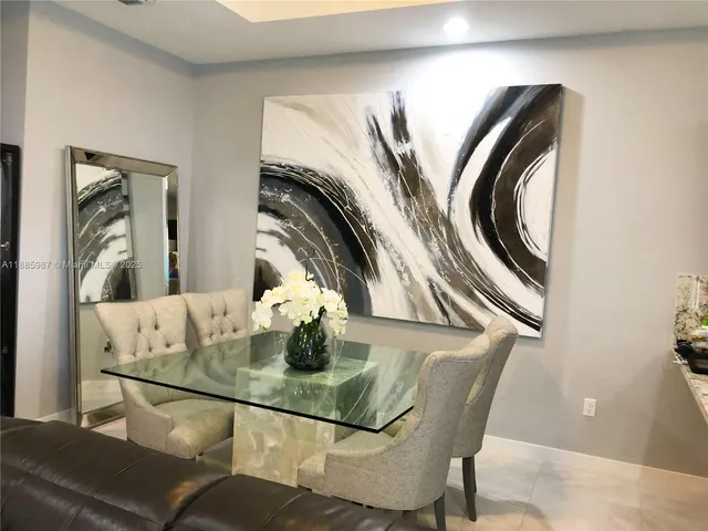 a view of dining room and kitchen