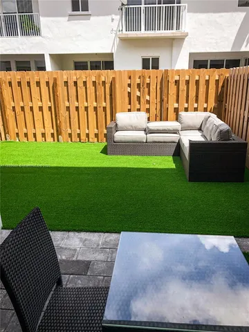 a view of a yard with a patio