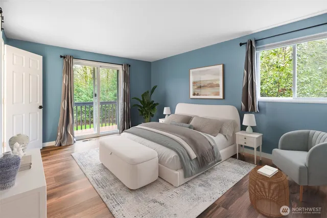 a bedroom with a bed and glass window