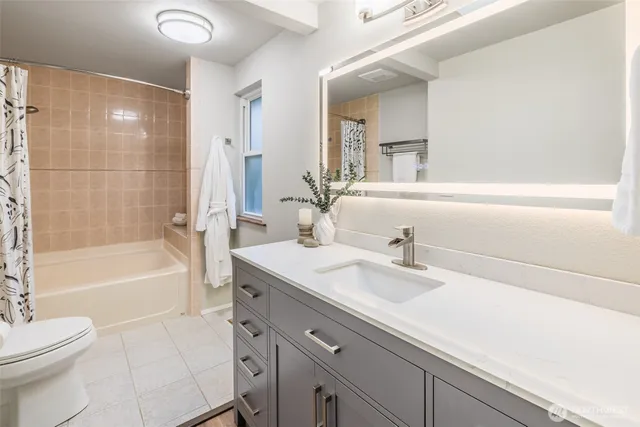 a bathroom with a sink a toilet and a bathtub