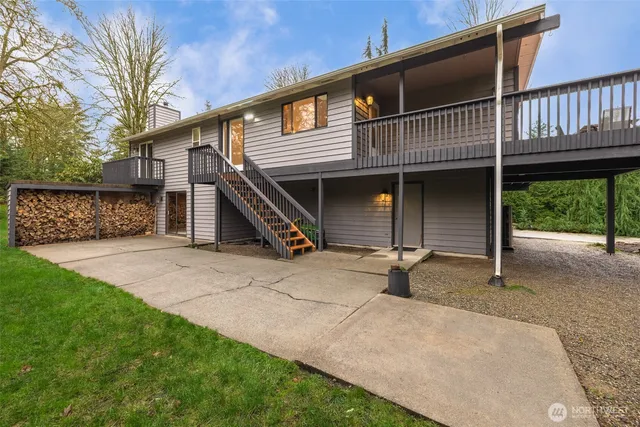 a wooden bench sitting in front of house
