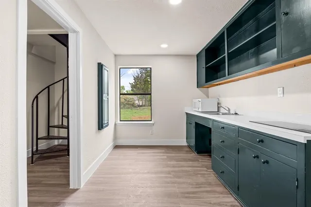 an empty room with windows and entrance