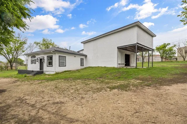 an aerial view of a house with a garden