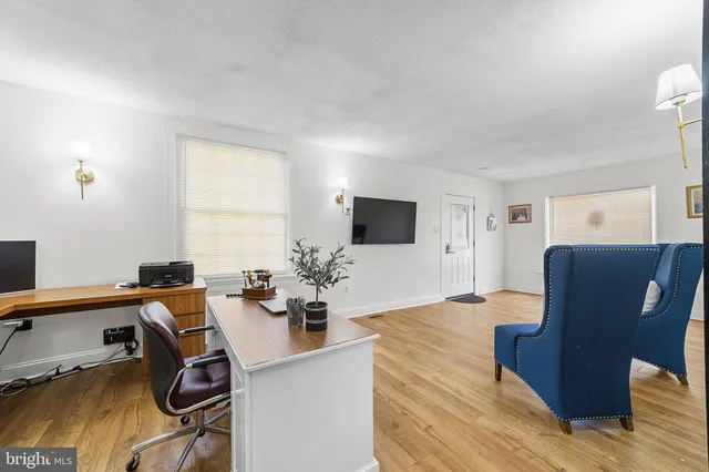 a kitchen with stainless steel appliances cabinets and a window
