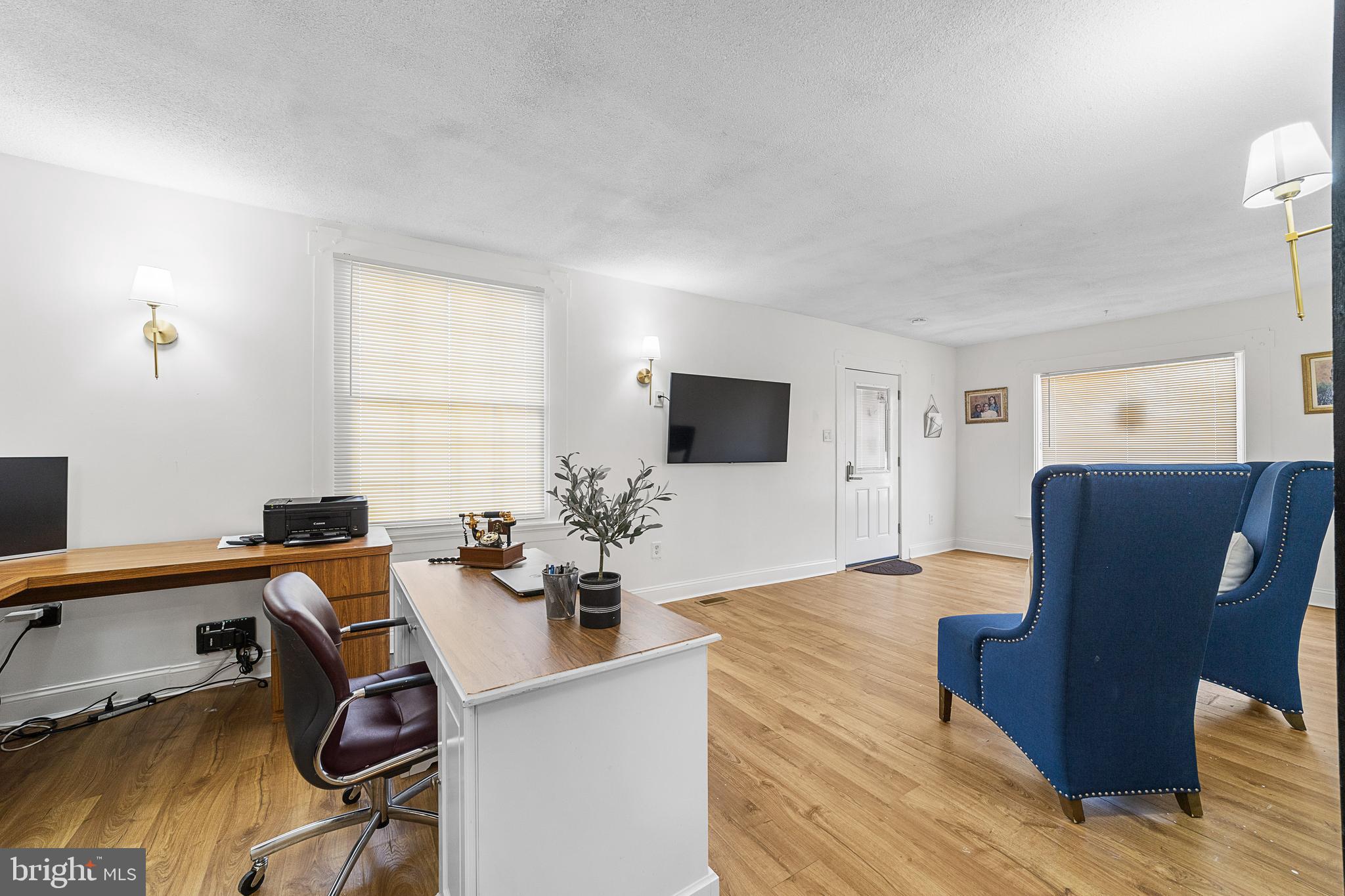 320 West Maple Avenue Merchantville, NJ 08109 - Photo 15 of 67 a view of a workspace with furniture and a flat screen tv