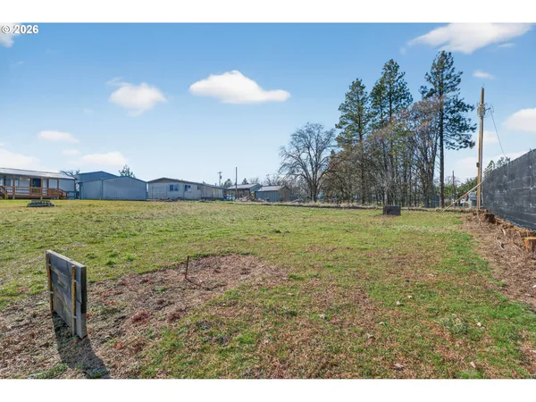 a view of a water fountain and a big yard