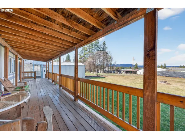 a view of balcony with wooden floor