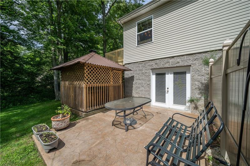 145 Elmbrook Road Beaver Falls, PA 15010 - Photo 23 of 25 Stamped patio and gazebo with hot tub