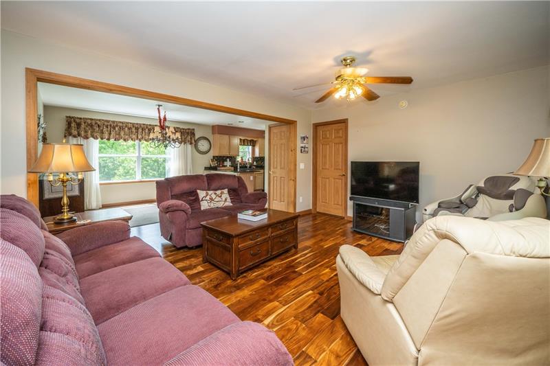 145 Elmbrook Road Beaver Falls, PA 15010 - Photo 4 of 25 Gleaming hardwood in the living room/dining area