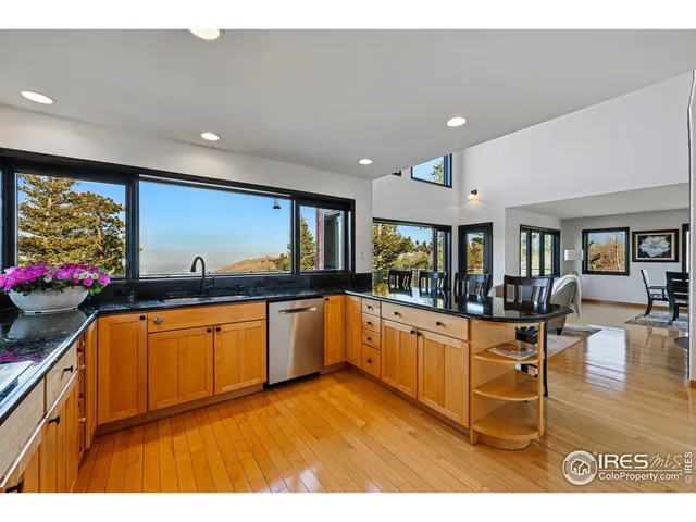 a kitchen with stainless steel appliances granite countertop a sink and cabinets