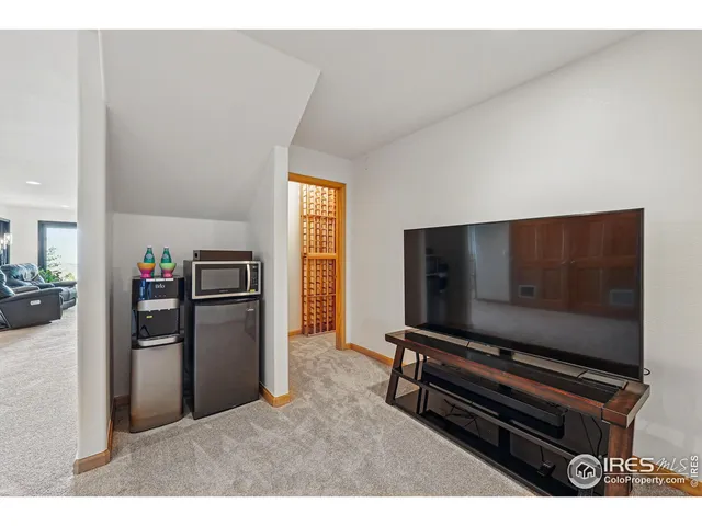 a spacious bedroom with a bed and a large window